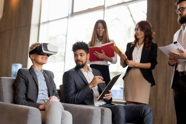 Business professionals evaluating a VR headset