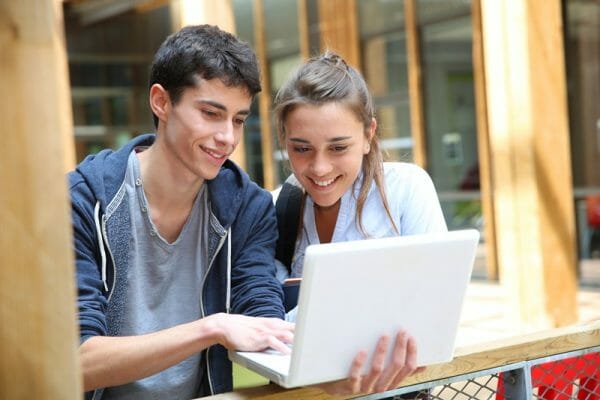 Two highschool students with a laptop